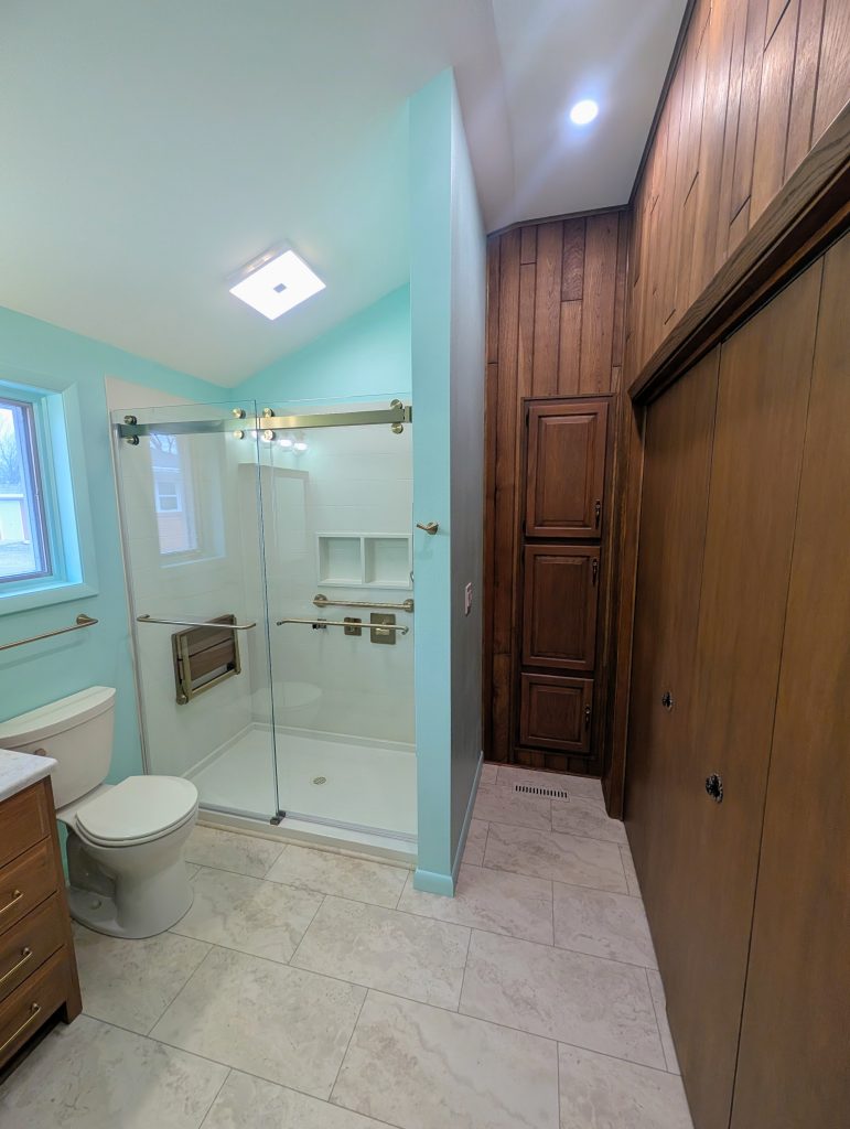 Completed aging in place bathroom remodel in Bowling Green, Ohio featuring a safe, accessible walk-in shower and improved lighting.