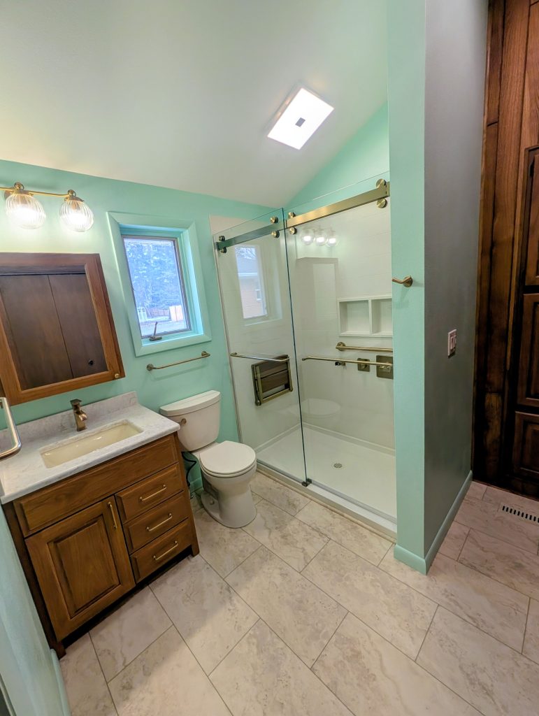 Updated bathroom flooring and vanity in an aging in place remodel in Bowling Green, OH, designed for safety and easy maintenance.