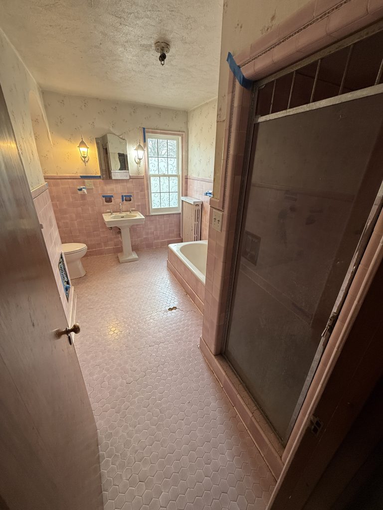 dated bathroom with pink tile before remodel in Northwest Ohio home